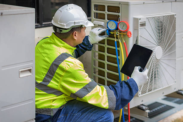 Professional Heat Pump Repair technician working in Symsonia, KY